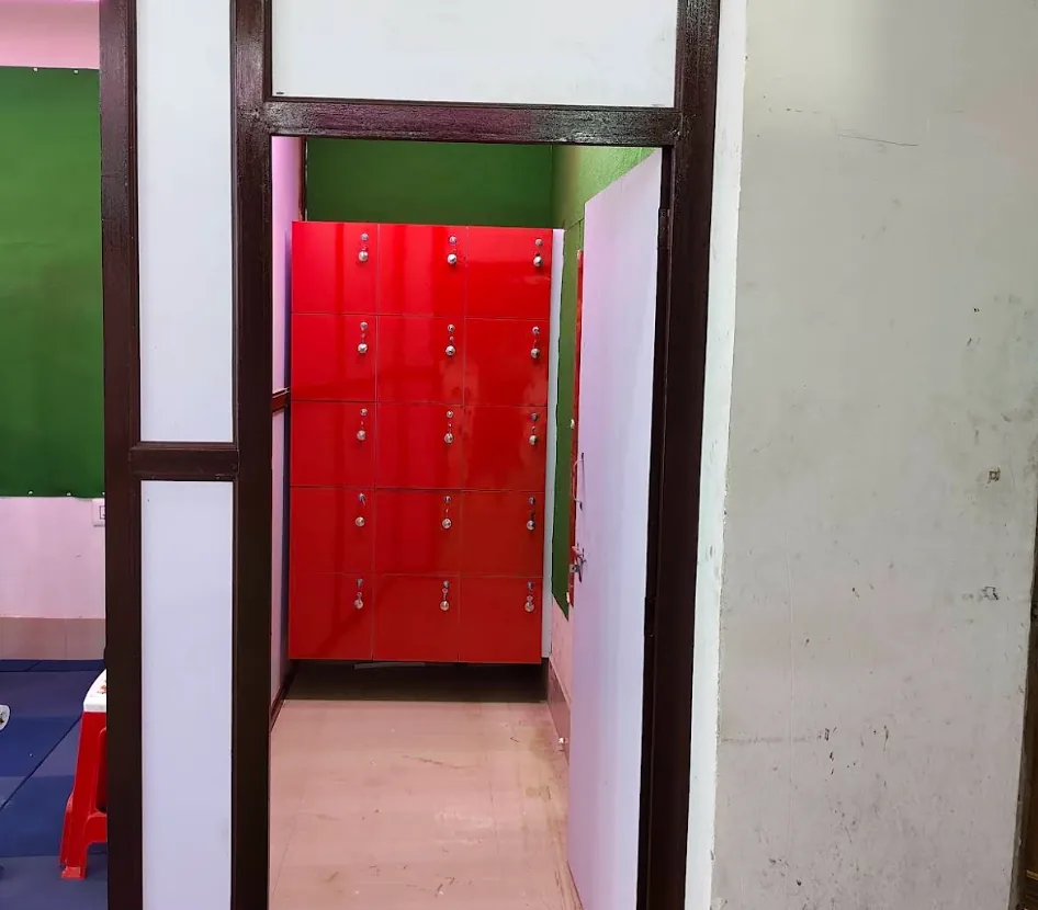 16-door red secure locker bank inside member changing area
